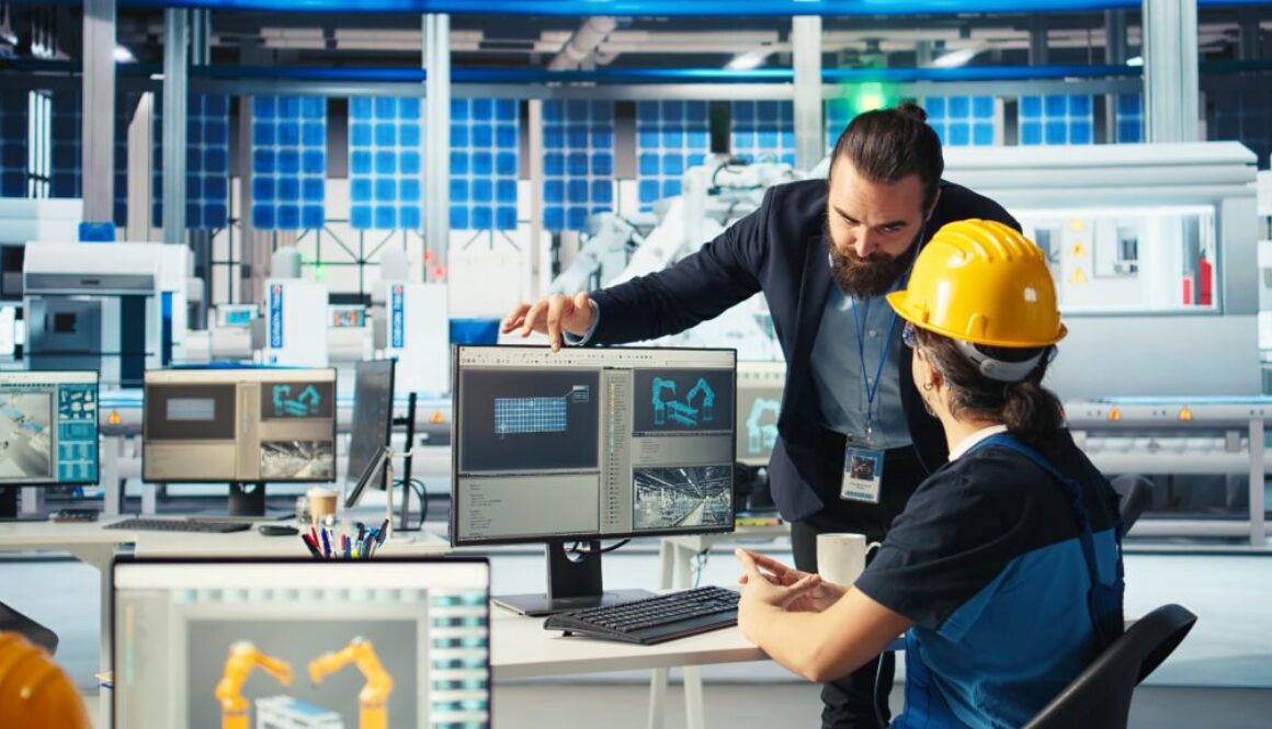 Solar panel plant manager showing engineer how to develop prototypes